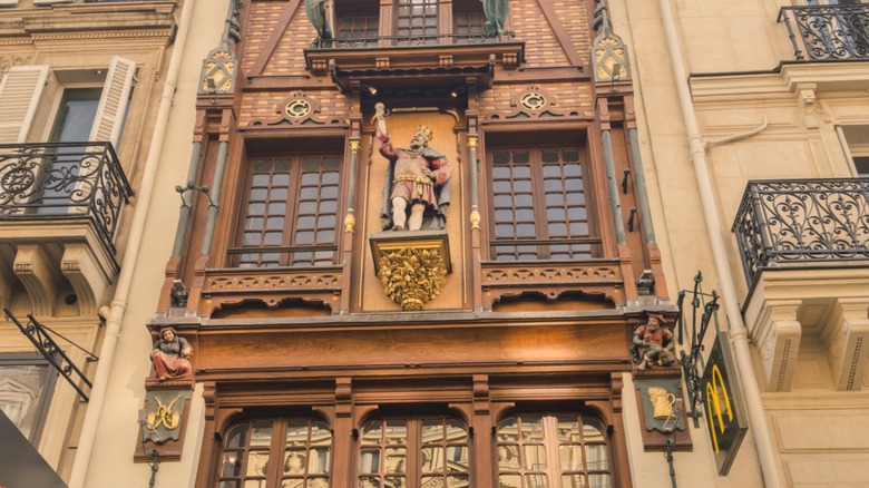ornate wood and brick facade of a McDonald's in Paris, France