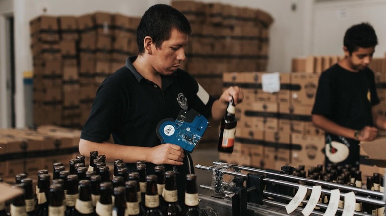 A Cerveceria Allende worker packs up beer