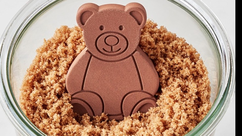Bear figurine in glass bowl of brown sugar