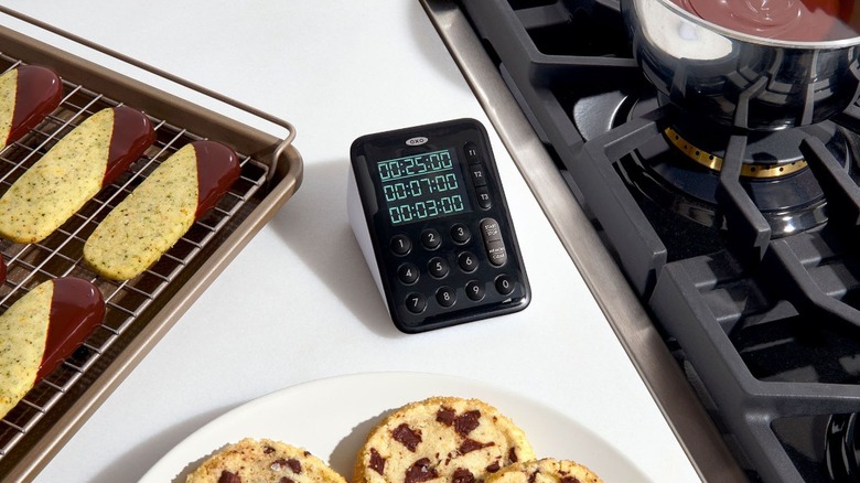 OXO Good Grips Triple Timer on counter next to stove top.