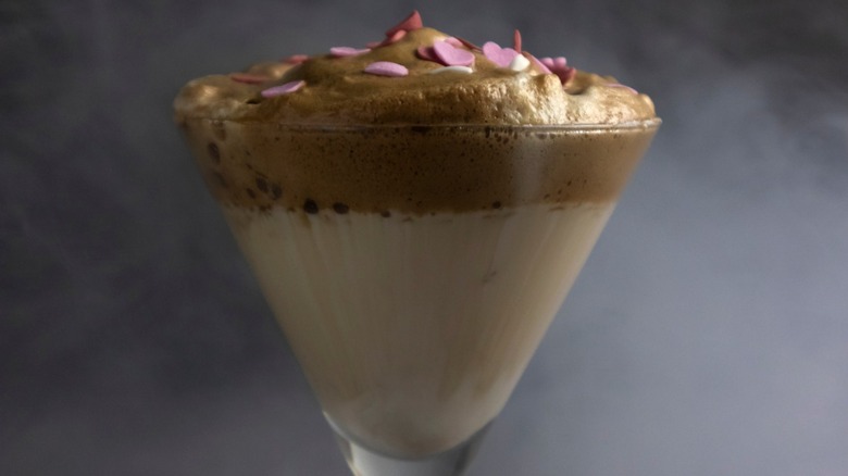 A dalgona martini in a cocktail glass