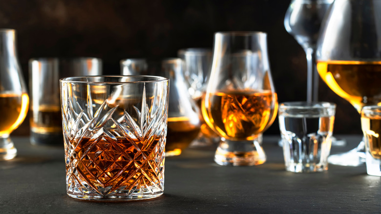 Dark booze in variously sized glasses.