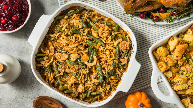 Green bean casserole, stuffing, and cranberry sauce on a table