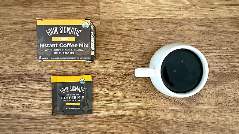 Box, package, and cup of Four Sigmatic mushroom coffee