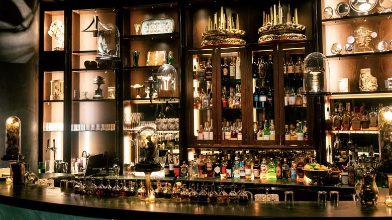 The bar at Deep Dive in Seattle stocked with different bottles and decor.