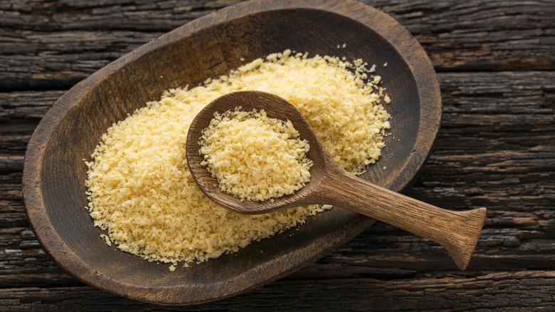a wooden spoon filled with panko breadcrumbs