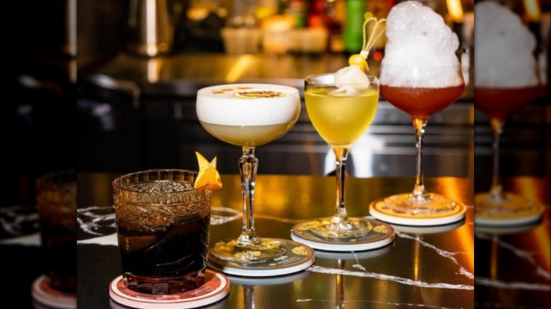 A lineup of pretty cocktails at Paper Fan cocktail bar in Seattle, WA.