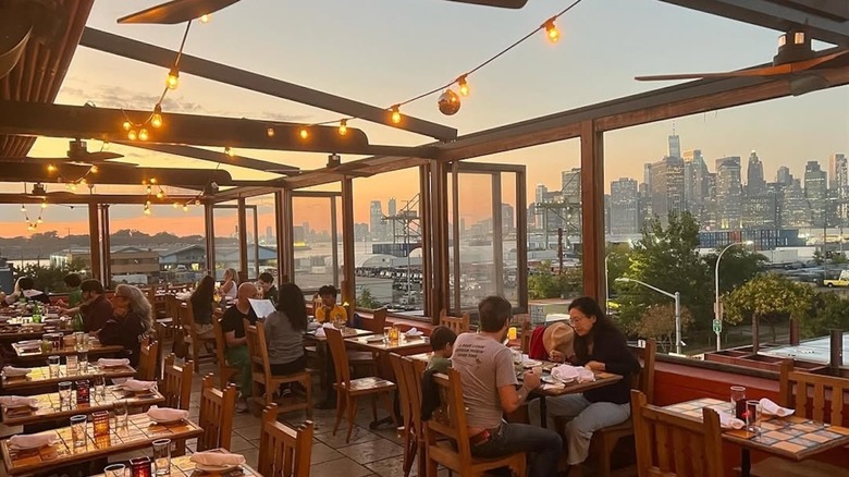 The rooftop at Alma restaurant in Brooklyn has a view of Manhattan's skyline