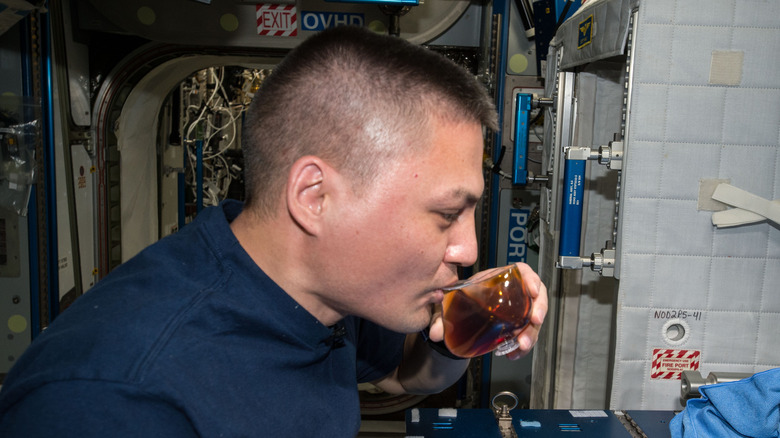 NASA astronaut sipping space espresso.