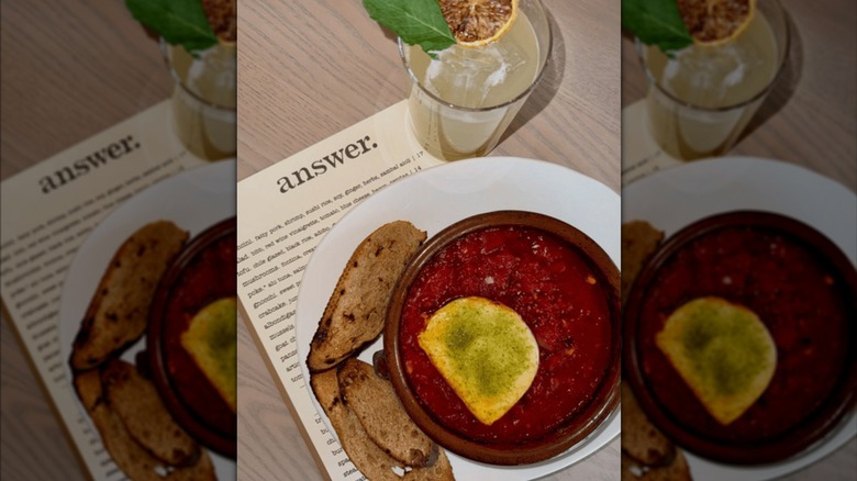 goat cheese and tomato sauce dip with drink