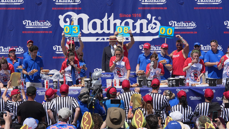 Competitors eating hot dogs at the annual Nathan's Famous International Hot Dog Eating contest