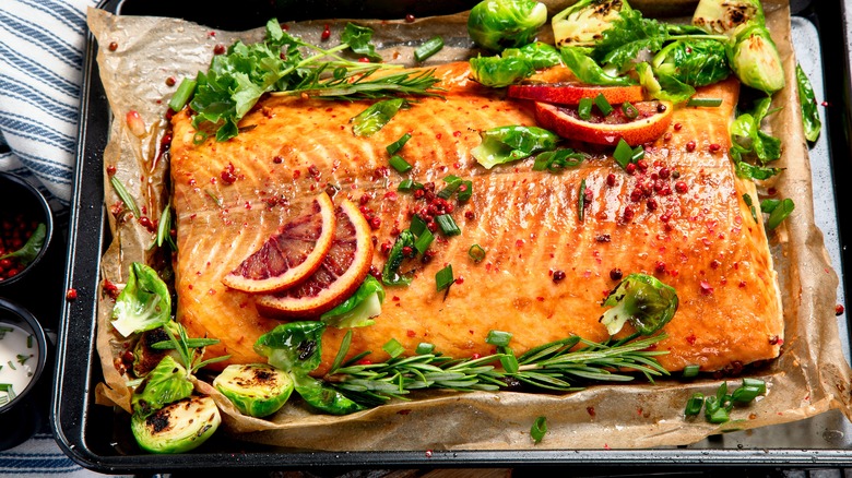Cooked salmon on baking sheet
