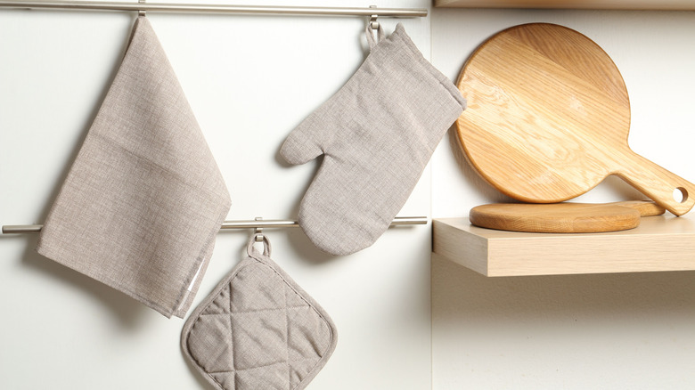oven mitt, towel, and pot holder hanging up