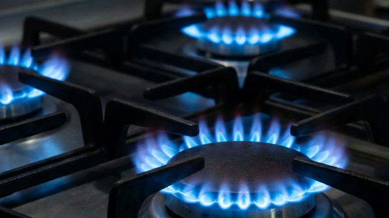 blue flames coming from gas stove burners