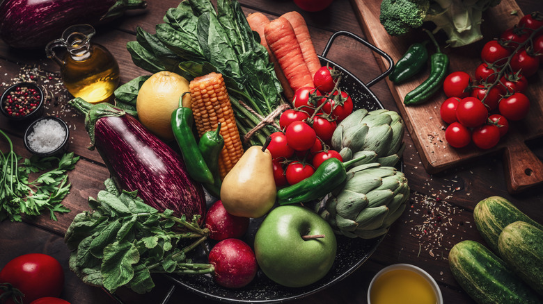 Fresh organic fruit and vegetables on a wooden table.