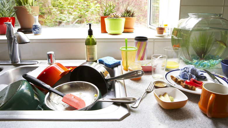 A sink full of dirty pots and pans after a meal is something to avoid by cleaning as you go and finishing the meal with final cleanup