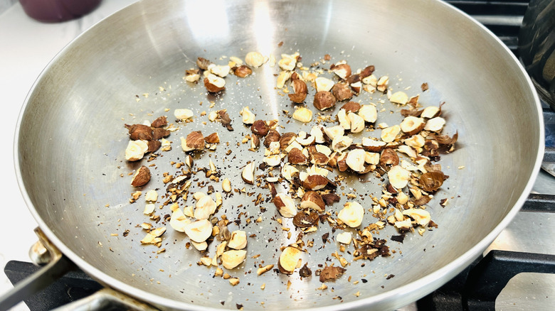 Hazelnuts toasting in pan