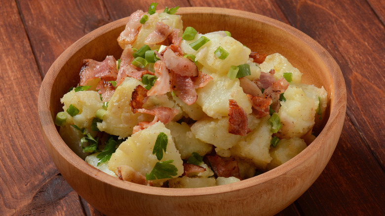 German potato salad with chopped bacon and green onions
