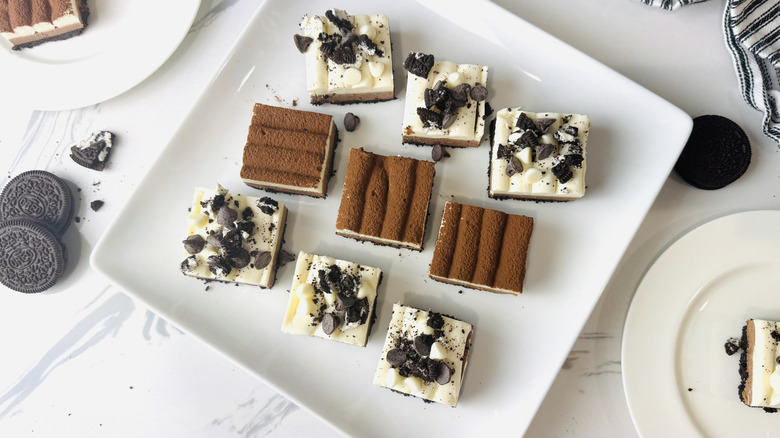 No-bake triple chocolate cheesecake bars on platter