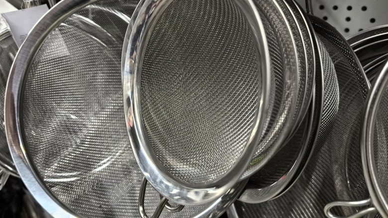 Stack of mesh strainers.