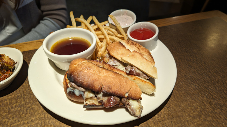 The french dip sandwich at Nordstrom's served with au jus and french fries