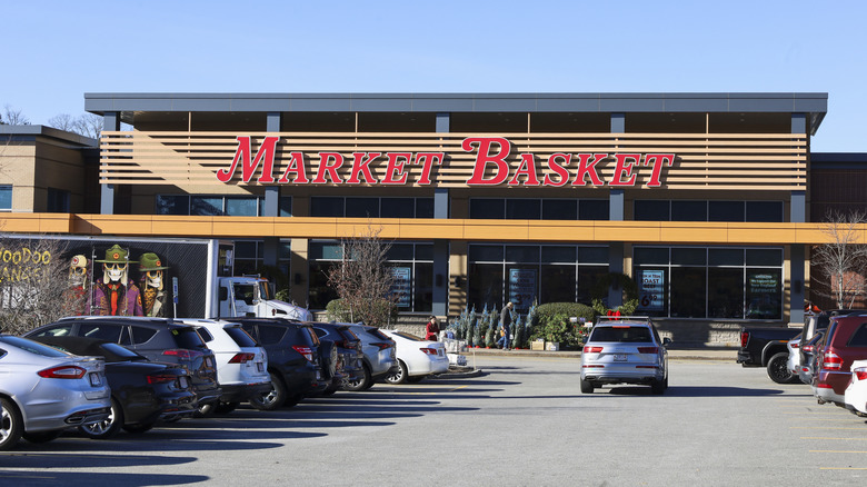 Market Basket storefront exterior and parking lot in Waltham, Massachusetts.