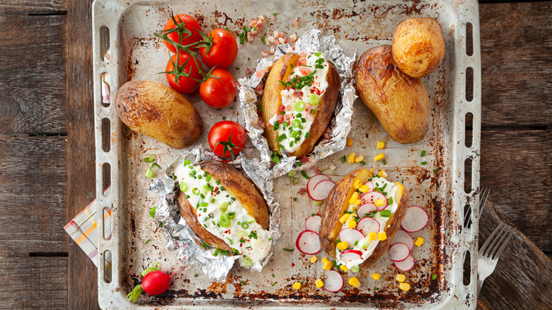 Baked potatoes on tray