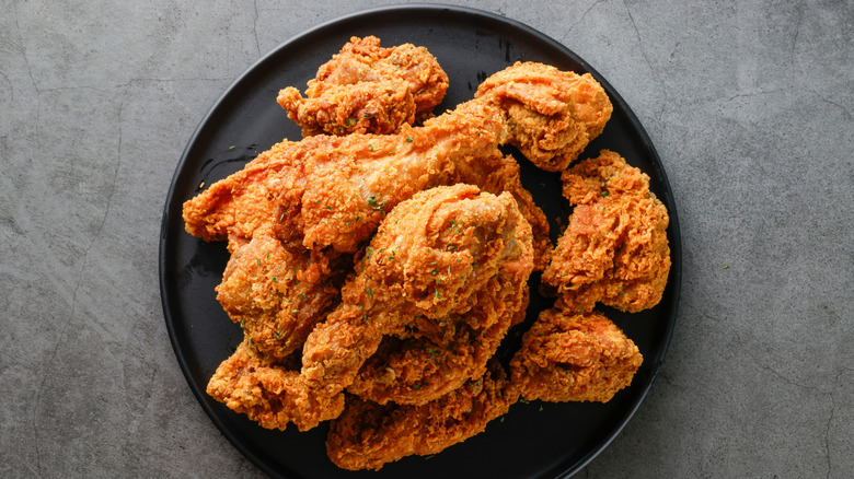 A plate of crispy golden fried chicken.