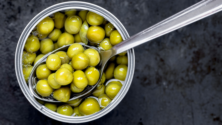 A spoonful of canned peas.