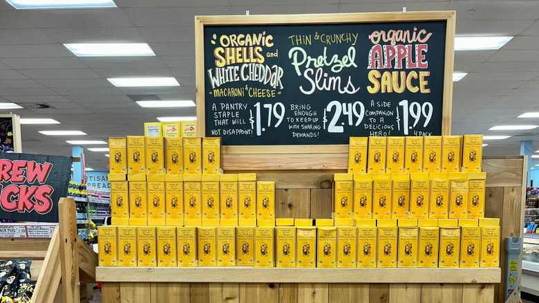 A display with boxes of Trader Joe's Organic Shells and White Cheddar mac and cheese
