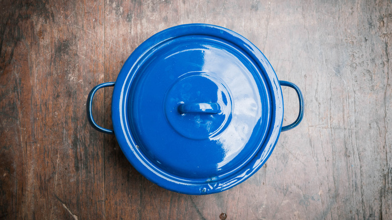 bird's eye view of blue pot on wood