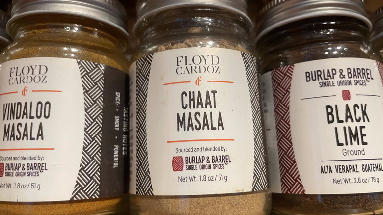 A jar of chaat masala in a spice collection