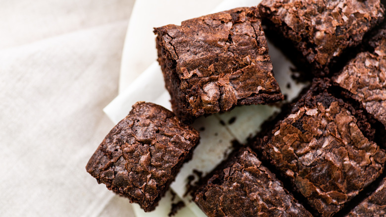 Squares of brownies on paper