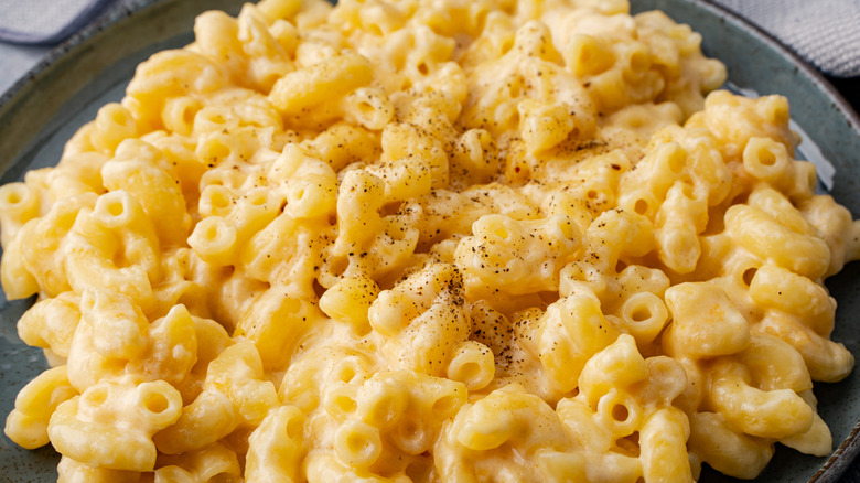 delicious mac and cheese on a black plate