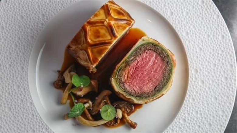 One if by Land, Two if by Sea's beef Wellington with mushrooms on a white plate