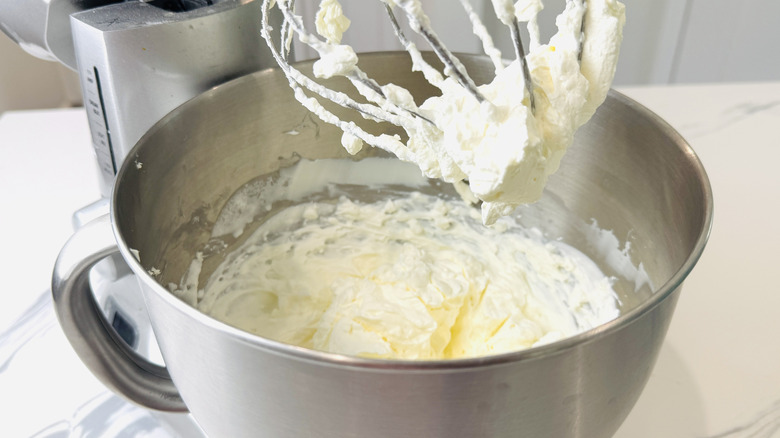 Whipped cream in mixing bowl