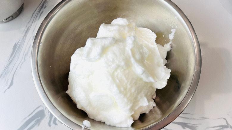 Whipped egg whites in bowl