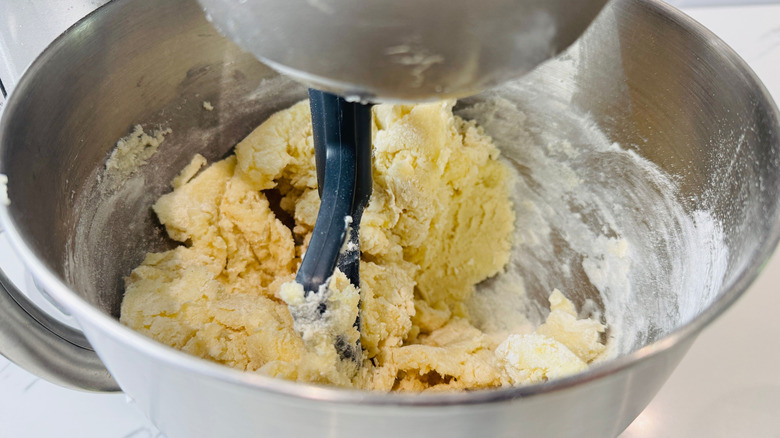 Cake batter in stand mixer bowl with paddle attachment