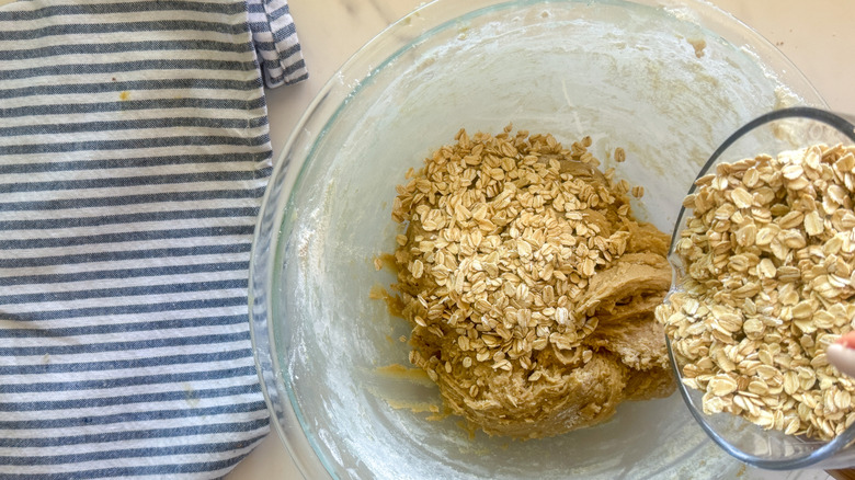 pouring oats into bowl