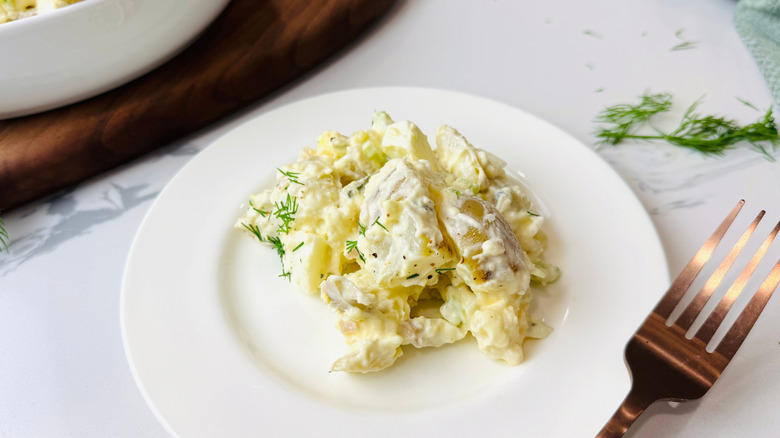Serving of potato salad on plate