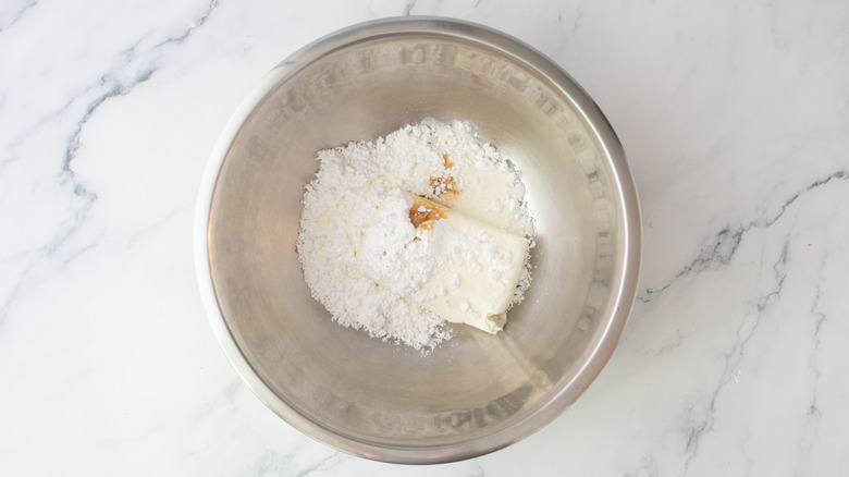 Cream cheese and assorted ingredients in a large bowl