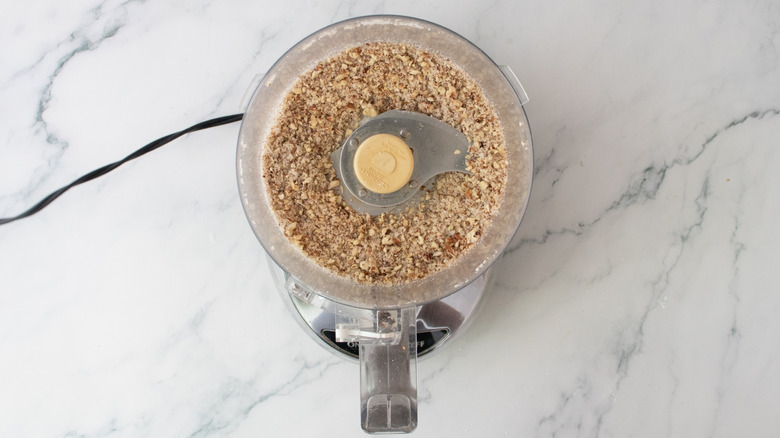 Finely crushed pecans and sugar in a food processor