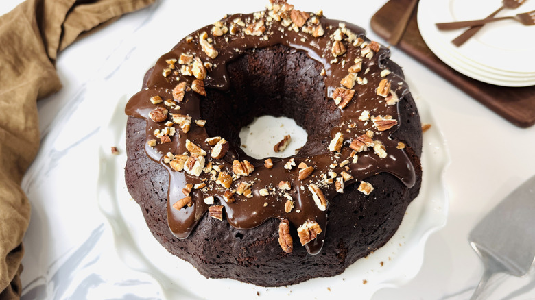 Tunnel of Fudge cake topped with chopped nuts