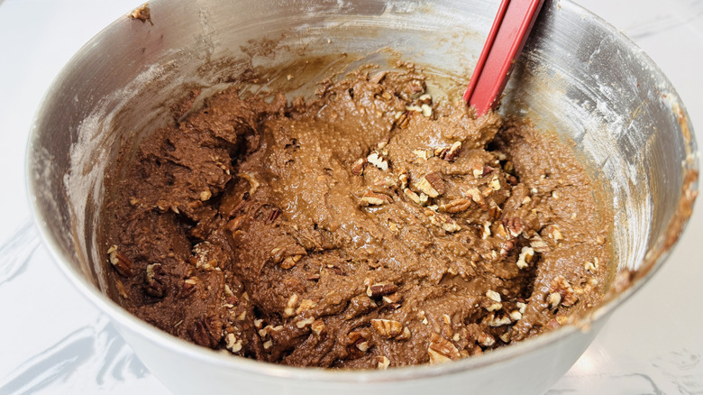 Pecans folded into chocolate cake batter