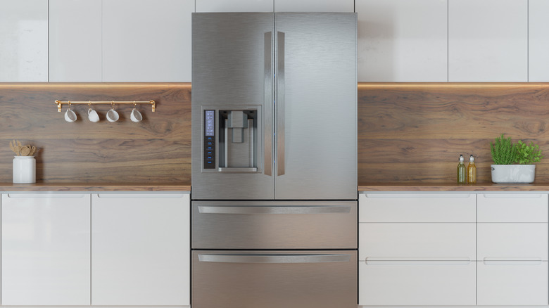 a stainless steel refrigerator in a modern kitchen