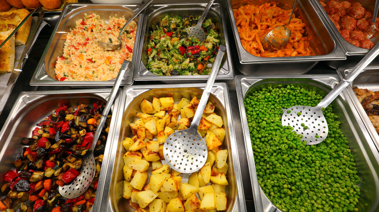 Buffet trays overhead shot with an array of foods.