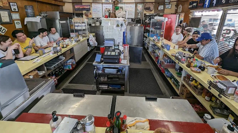 Customers sitting at the counter at Nick's Café