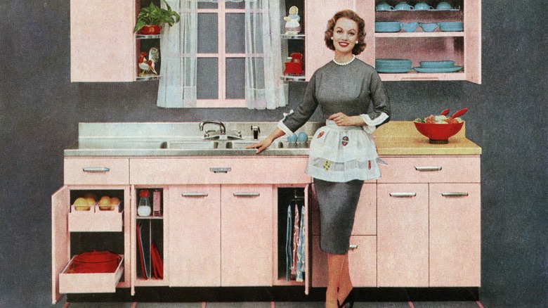 A vintage ad with a woman in a pink pastel kitchen