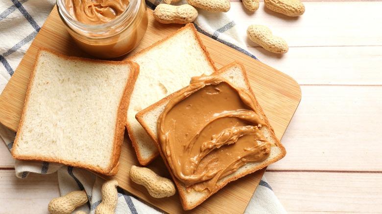 peanut butter sandwich on a wooden board