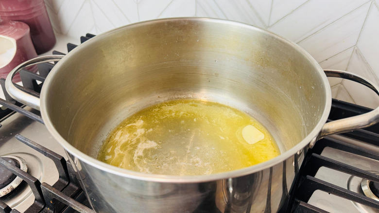 Melted butter in large pot